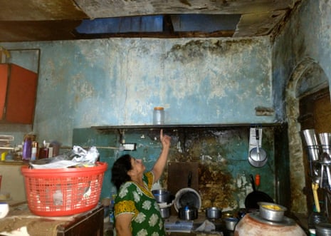 Heena Tolani points to a section of collapsed ceiling in the kitchen of her Mumbai home. 