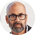 Rumaan Alam, a man in glasses looking ahead in portrait