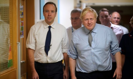 Boris Johnson (right) and Matt Hancock visiting a hospital