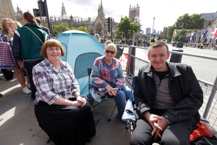 L-R Anita Last, Sue Kaminski and Ben Watts waiting on Parliament Square for tomorrow's funeral.