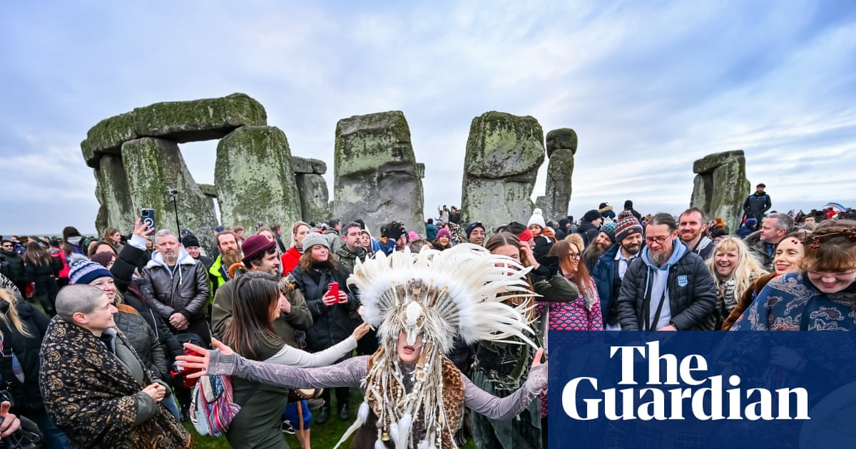 ‘I feel special, in my heart’: thousands gather at Stonehenge for winter solstice
