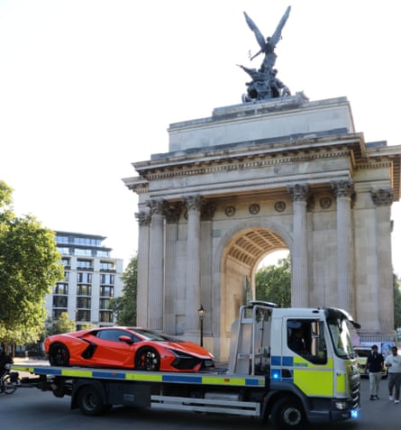 seized Lambourghini Revuelto on the back of a police flatbed truck