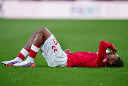 Patrick Dorgu lies stretched out on the turf