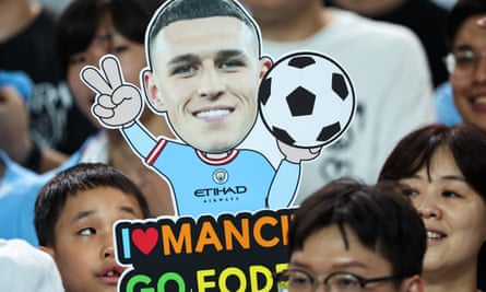 Korean fans display a Phil Foden cutout during Manchester City’s preseason tour.