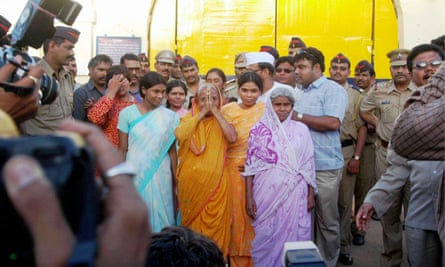 Women outside the district court in Nagpur, India, on 18 August