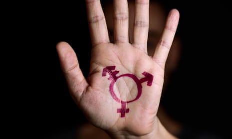 A transgender symbol painted in the palm of the hand.