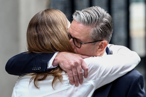 Keir Starmer embracing his wife Victoria after his speech.