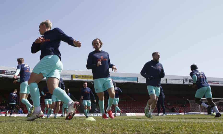 Grimsby Town players warm up at Blundell Park