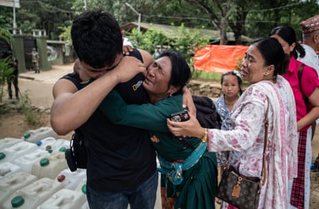 People hugging at the camp