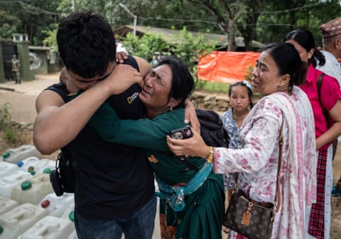 People react after the flood disaster at an army barracks in Bidur, where Nepal’s rescue efforts were being co-ordinated