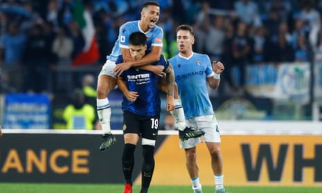 Lazio’s Luiz Felipe jumps on the back of his former teammate Joaquin Correa, of Internazionale
