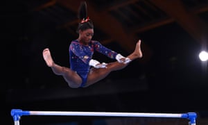 Simone Biles in action on the uneven bars.