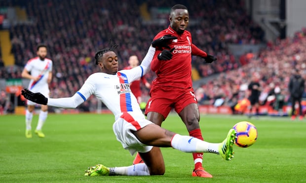 Aaron Wan-Bissaka dispossesses Liverpool’s Naby Keïta at Anfield.