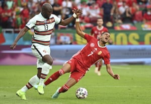 Portugal’s Danilo Pereira, left, challenges for the ball with Hungary’s Loic Nego.