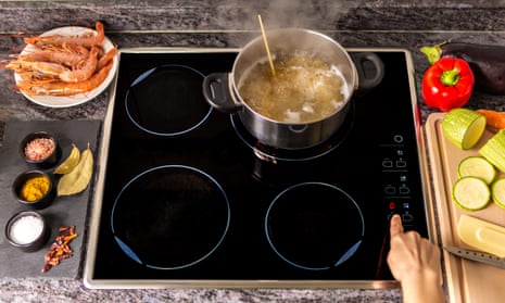 A pot boiling on an electric cooktop