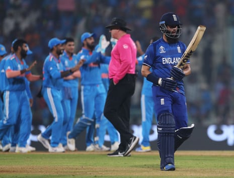 Moeen Ali of England walks off.