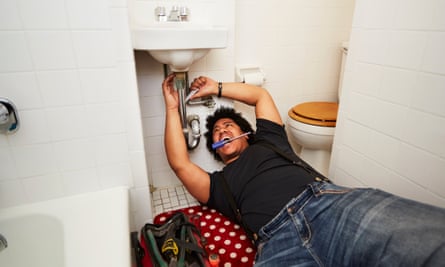 Man fixing a bathroom sink