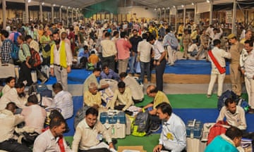 Polling officials gather to submit electronic voting machines (EVMs) at a secure location after people voted during the seventh phase of voting on 1 June 2024 in Varanasi, India.