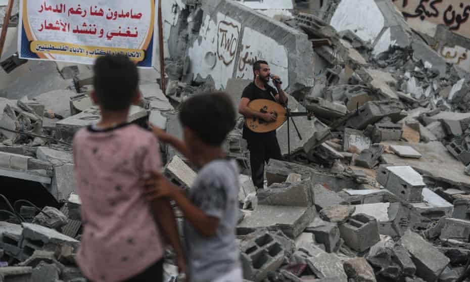 The Egyptian band Devavin perform on 15 August in the ruins of the Said al-Mishal Cultural Centre in Gaza, which was destroyed by Israeli airstrikes six days earlier