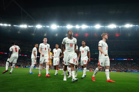 Myles Lewis-Skelly and Lewis Hall with a group of England teammates at Wembley