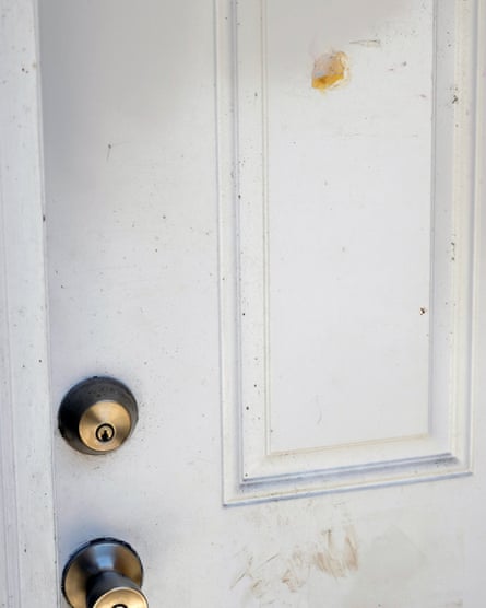 A patched bullet hole on the door through which Owens was shot.