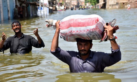 People affected by floods move to higher grounds in Khairpur Nathan Shah, Dadu district, Sindh province, Pakistan