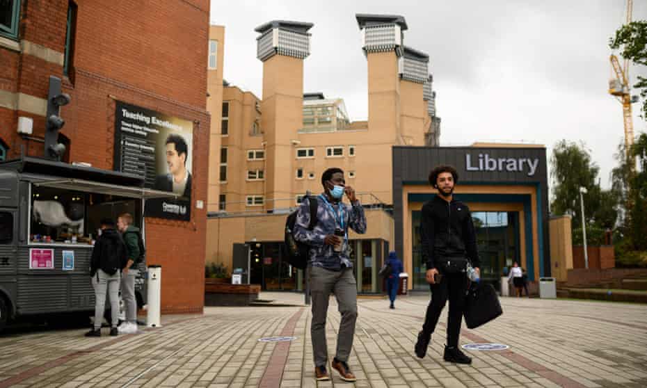 Students walk past Coventry University library last September
