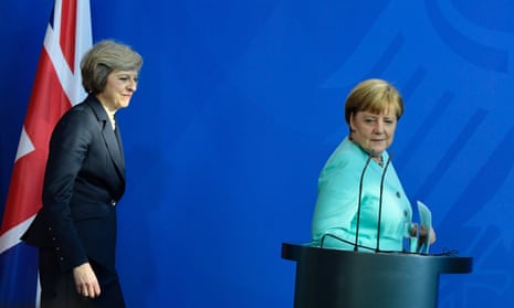 Angela Merkel (right) and Theresa May preparing to address a press conference in Berlin in July 2016