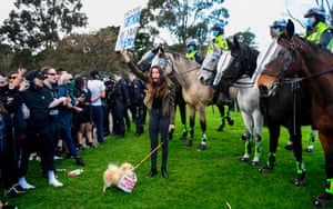 Protesters confront police at the Shrine of Remembrance in Melbourne during a rally opposing the state’s strict lockdown.