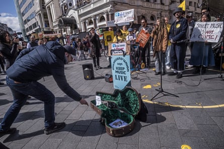 A member of the public makes a donation inside an instrument case