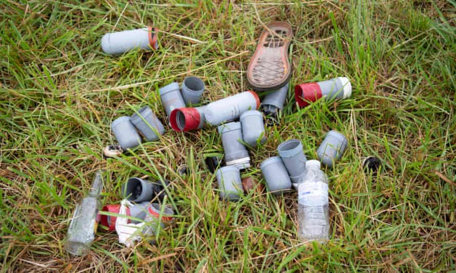 Empty tear gas canisters are seen on the grass during an illegal rave in Redon.