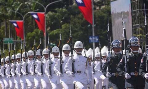 Soldiers march during the national day celebration in Taipei, Taiwan, in October 2021