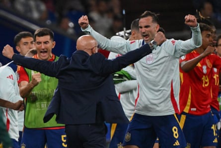 Spain’s head coach Luis de la Fuente (back turned) celebrates with Fabian Ruiz as they beat Italy 1-0.