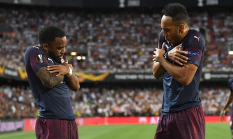 Alexandre Lacazette (left) and Pierre-Emerick Aubameyang celebrate an away goal for Arsenal against Valencia.
