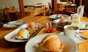 Dishes arranged on a wooden table at Isolina: Taberna Peruana, Lima, Peru.