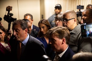 people stand in an elevator bay
