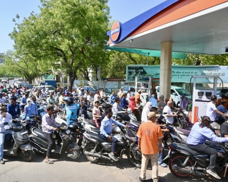People queuing to refill with fuel at a station in Ahmedabad, India, this week