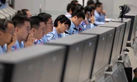 Technical staff at the Beijing Aerospace Control Centre work during the Chang’e-6 mission.