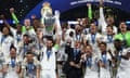 Real Madrid’s Nacho lifts the trophy as he celebrates with teammates after winning the Champions League.