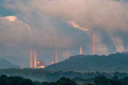 Heavy haze as pollution and steam rise from the stacks of Miami Fort power station in Ohio