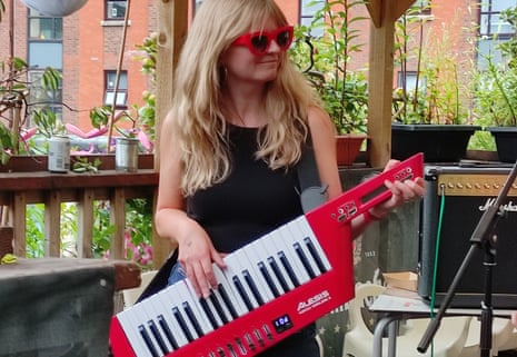Helen Pidd playing her keytar at a gig in Manchester