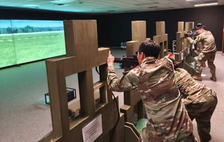 American and South Korean soldiers train with weapons on digitally projected terrain