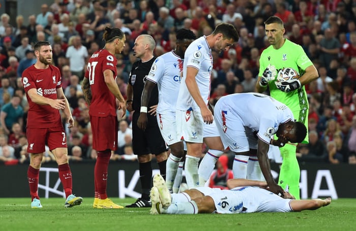 Crystal Palace's Joachim Andersen lies on the floor after being butted by Liverpool's Darwin Nunez, who is sent off.