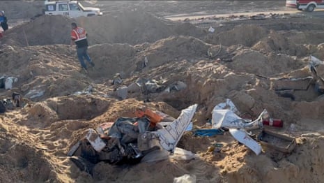 Ambulances and UN vehicle excavated from the sand – video