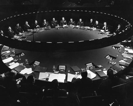 A scene from Dr Strangelove, Or How I Learned to Stop Worrying and Love the Bomb in which dozens of politicians and generals sit around a large round table