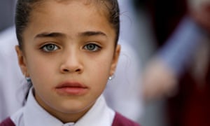 A Hazara girl attends an assembly prayer