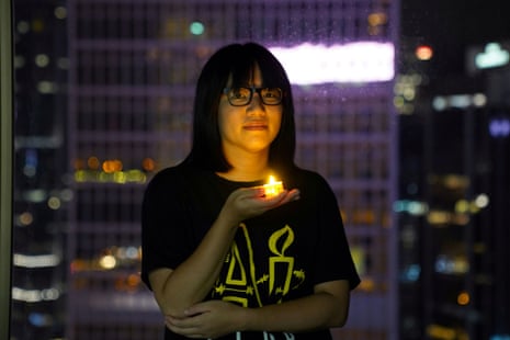 Chow Hang-tung poses with a candle ahead of the 32nd anniversary of the crackdown on pro-democracy demonstrators at Beijing’s Tiananmen Square in 1989, in Hong Kong. June 2021.