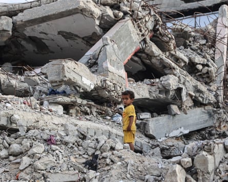 A Palestinian child stands on the rubble of a destroyed building near the al-Shati refugee camp, west of Gaza City, last week.
