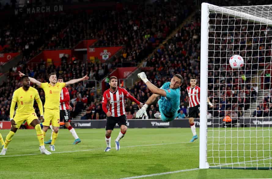 Diogo Jota celebrates and Divock Origi hopes as Alex McCarthy of Southampton stretches and fails to keep out Joël Matip’s winning goal.