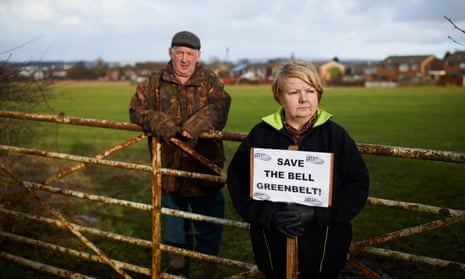 Jimmy and Gillian Morris campaigning against proposals to build hundreds of houses and a motorway link road within the green belt on their farm land at Kitt Green, Wigan